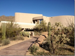 adobe building with desert landscaping