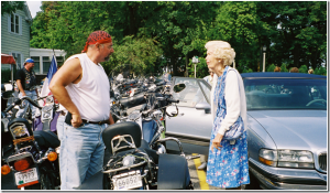 Harley rider and senior woman conversing